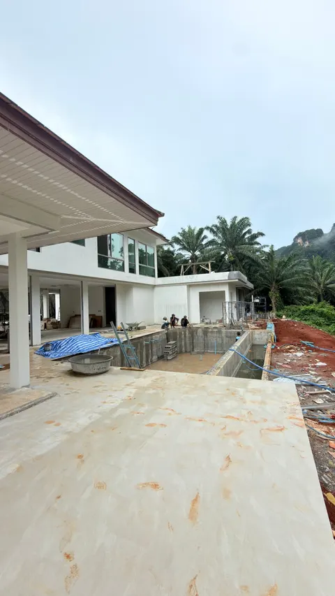 Pool villa under construction in Krabi, Thailand by Ton Korsrang